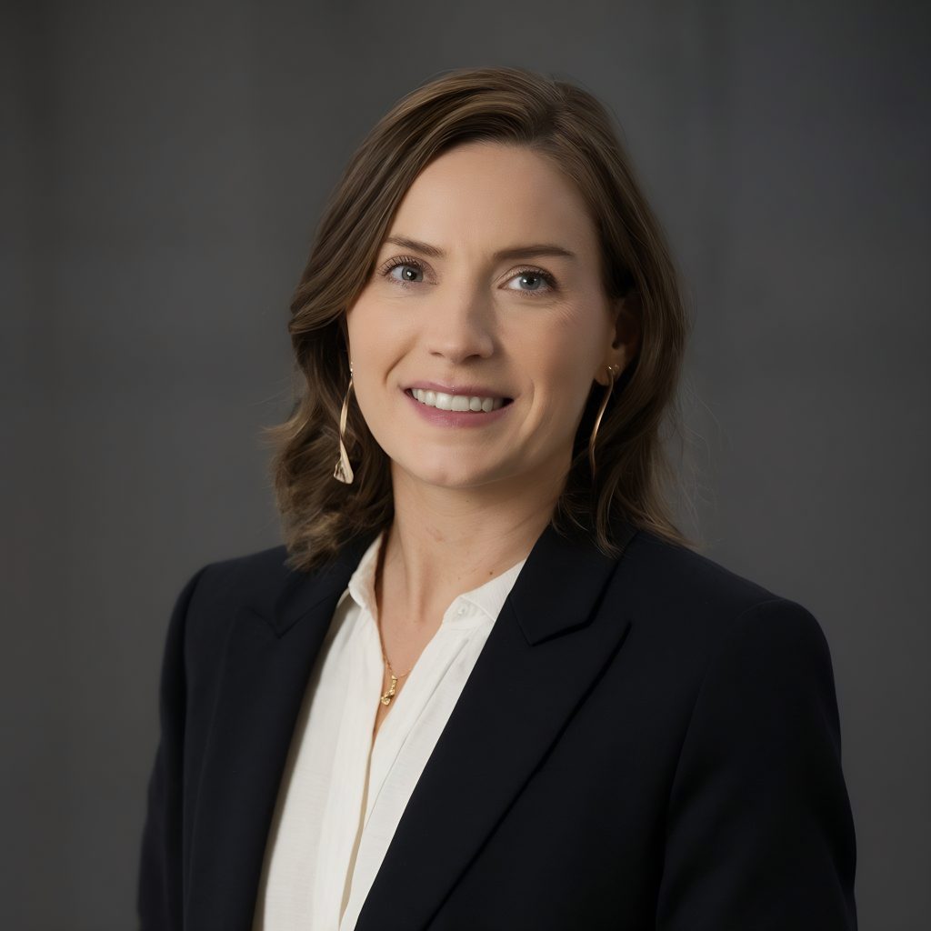 woman wearing black jacket white shirt with gold earrings